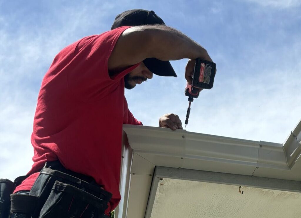 Man working on gutters